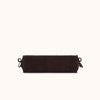 A dark brown cylindrical bolster pillow with adjustable tie straps on both ends, shown against a solid off-white background.