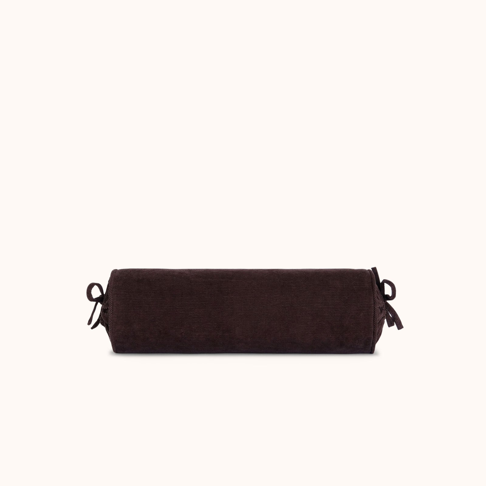 A dark brown cylindrical bolster pillow with adjustable tie straps on both ends, shown against a solid off-white background.
