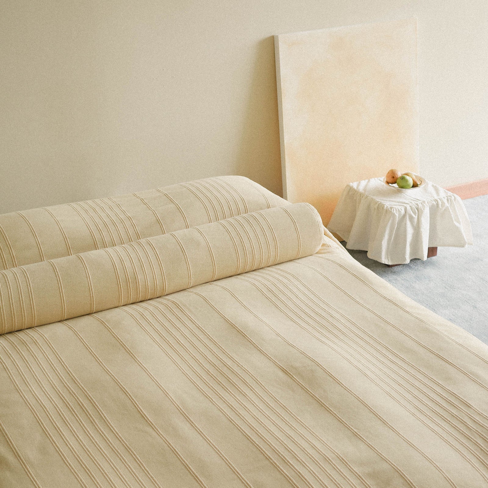Morrow Soft Goods Devi Coverlet and Devi Bolster in Maiz - lifestyle image