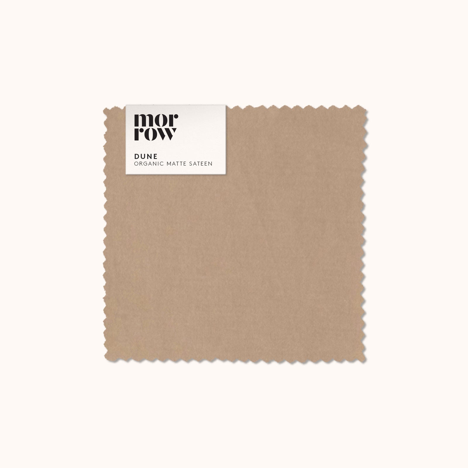 An organic matte sateen Dune fabric swatch with a Morrow label