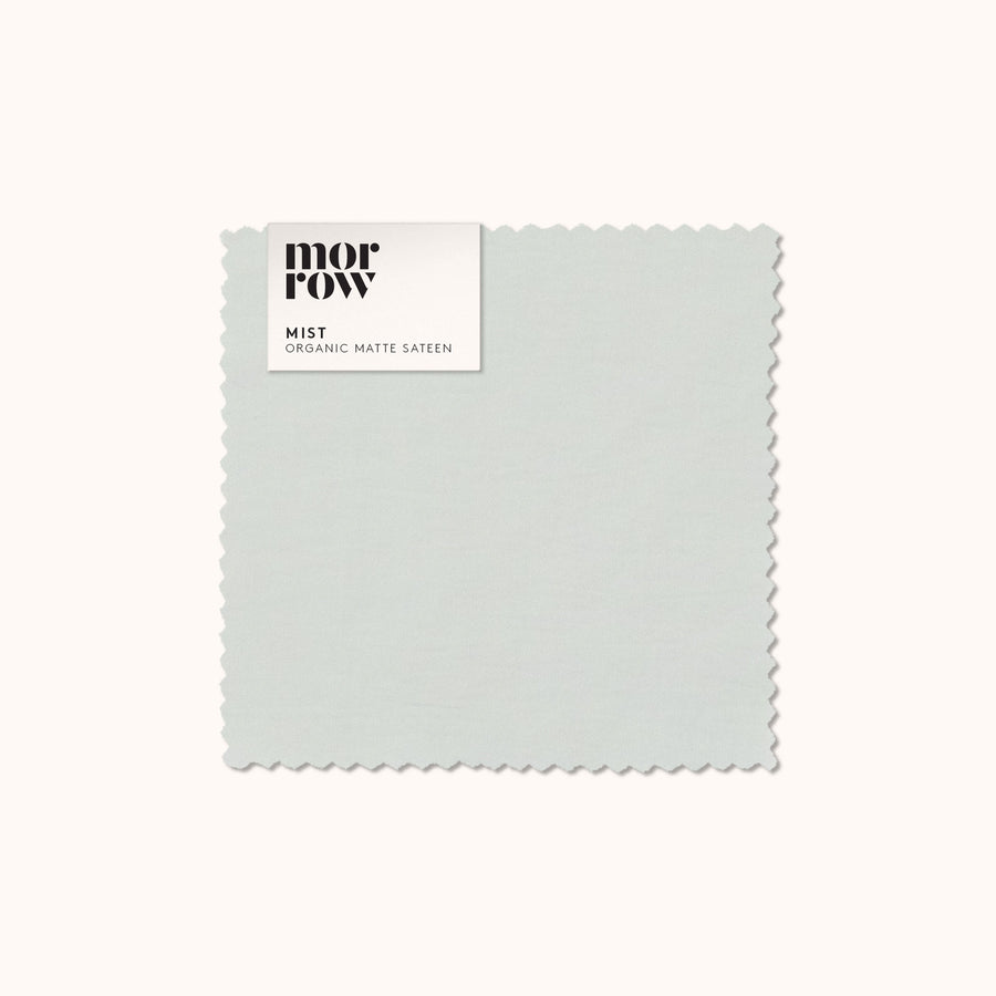 An organic matte sateen Mist fabric swatch with a Morrow label