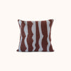A square throw pillow featuring a textured, hand-knotted pattern of vertical wavy stripes in dark brown and light blue, set against a plain off-white background.