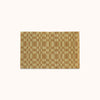 A rectangular mat with a pale olive and light brown checkerboard pattern, displayed flat against a solid off-white background.