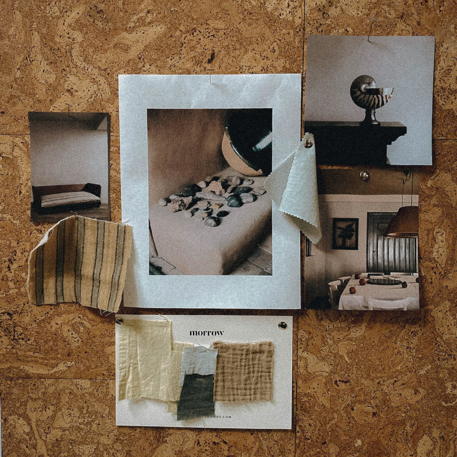 A corkboard-style collage with several printed interior photos, fabric swatches, and a card labeled 'morrow', arranged on a brown cork background.