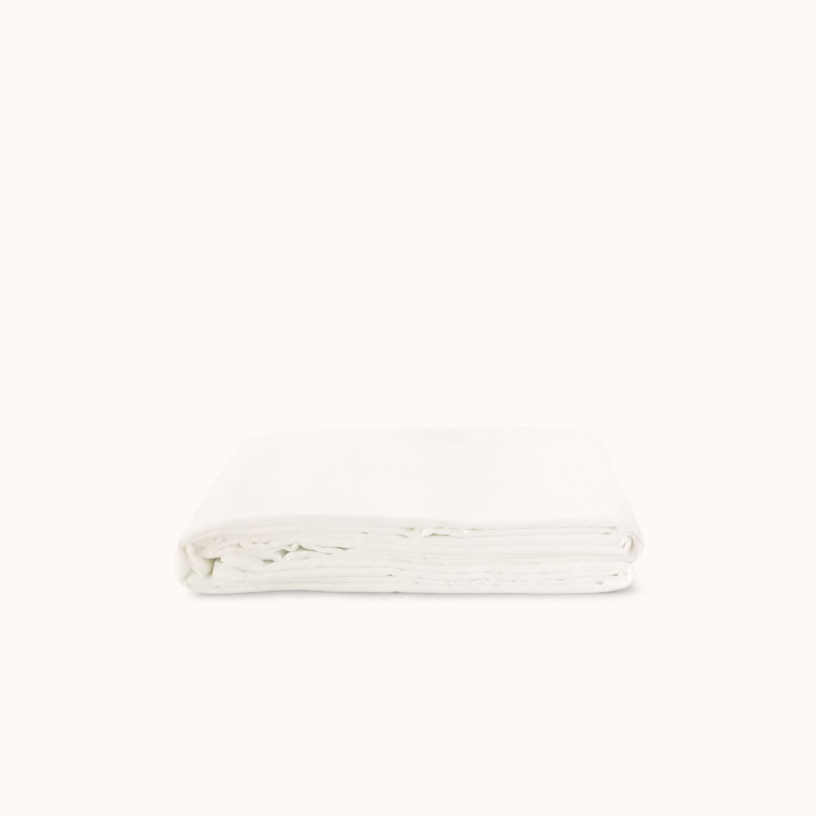 White folded flat sheet on a white background