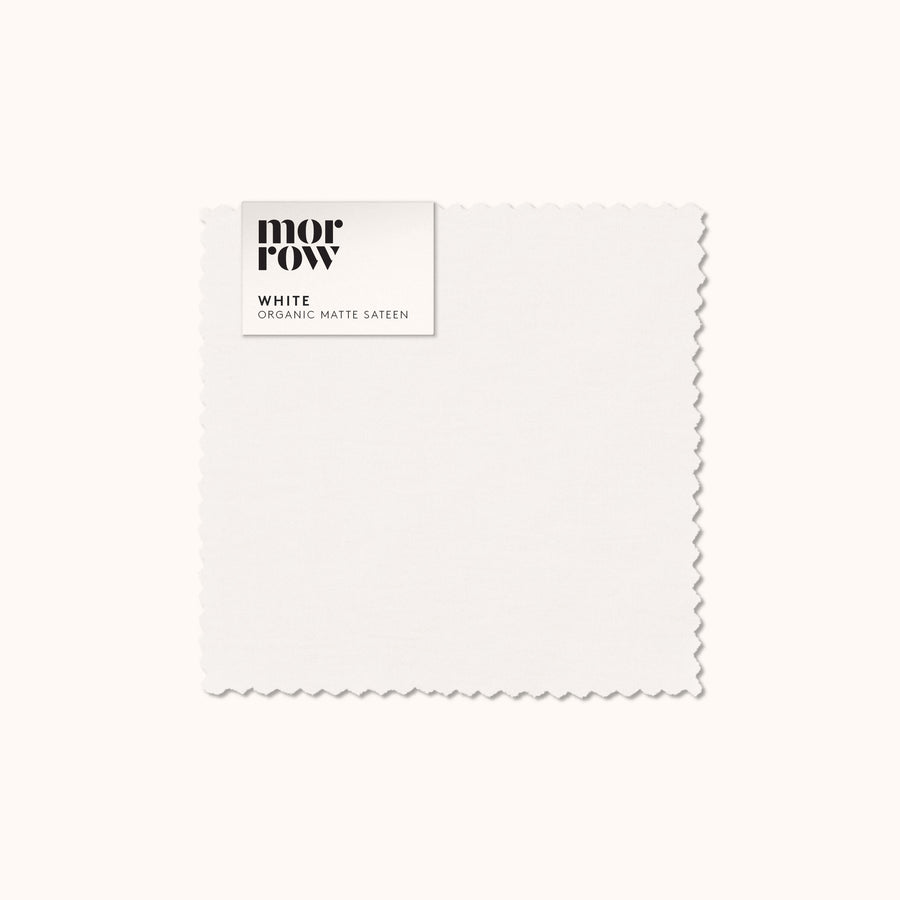 An organic matte sateen White fabric swatch with a Morrow label
